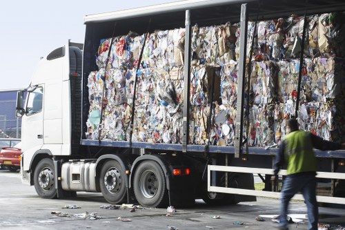 Staff sorting recyclables during a Stratford flat clearance service